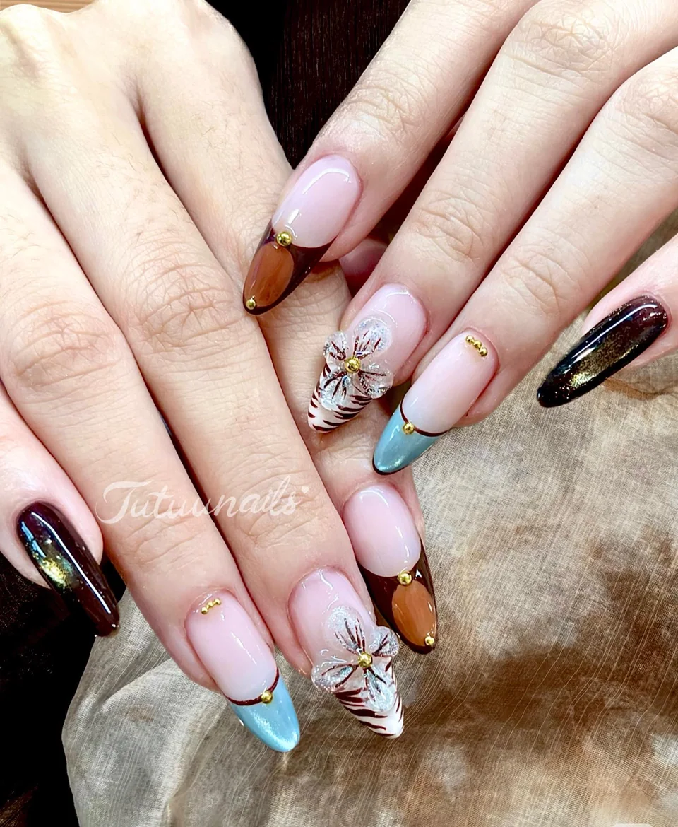 TUTUUNAILS manicure: mixed French tips with raised flowers and striped accents